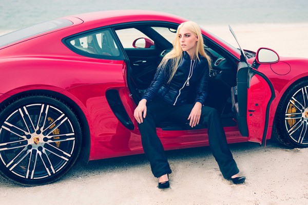 The model wears a nylon jacket and drawstring trousers from Louis Vuitton; Patent platform stilettos from Saint Laurent. The car featured is a 911 Carrera GTS in Carmine Red