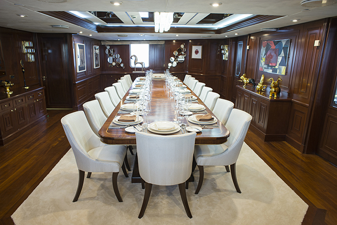 The stately dining area of the Chakra superyacht