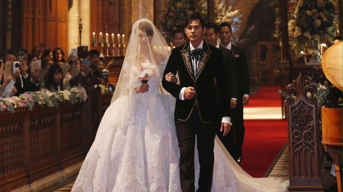 Jay Chou walks down the aisle with bride Hannah Quinlivan.