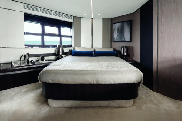 The bed is set diagonally in the full-beam master suite