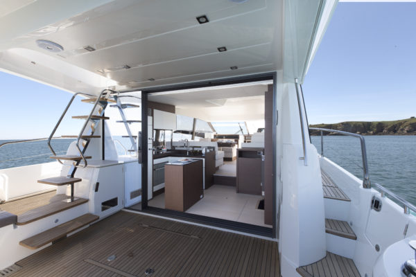 An improved cockpit layout leads into a split-level saloon with aft galley; Photo © Jean-Marie LIOT pour Prestige Yacht