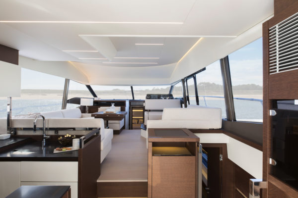 Compared to the saloon on the 500, Camillo Garroni has created larger windows and more space, shifting the owner’s staircase aft; Photo: Jean-Marie LIOT / Prestige Yachts