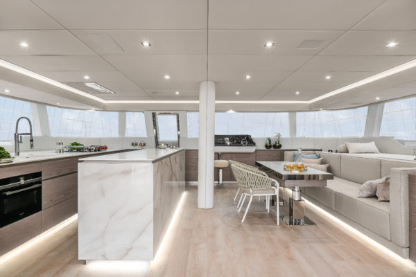 The light decor and big windows around the superstructure create a bright, inviting interior, which also includes a door to the foredeck