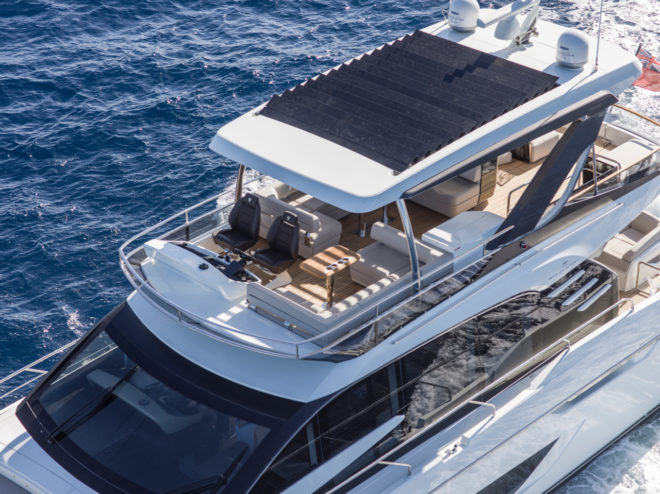 The Squadron 68 has a large flybridge and a hardtop featuring pivoting slats that can be partially or fully open, or completely closed