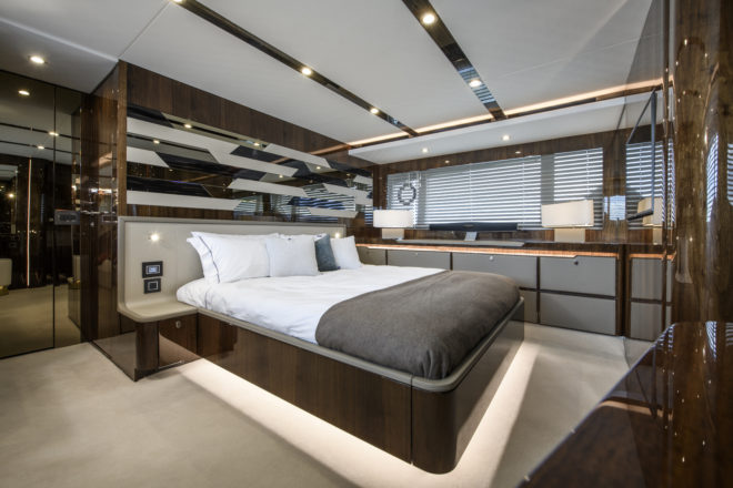 The impressive, full-beam master suite on a different Fairline Squadron 68 to the one shown on the previous interior photos, although both units feature gloss walnut woodwork