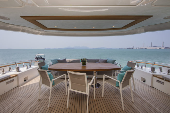 The covered aft cockpit (above) and multi-functional foredeck (below) are among the popular outdoor areas on the 86ft yacht, which is in Hong Kong and available
